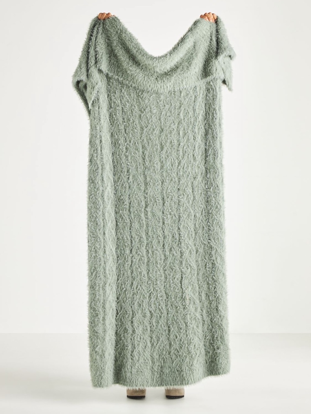 Anthropology Camden Throw Blanket combines softness with a cable-knit design.